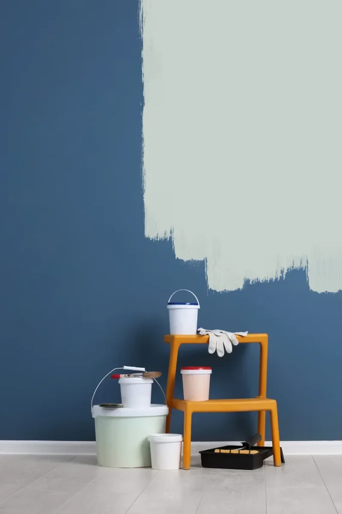 Skilled painters providing apartment painting services in a furnished flat